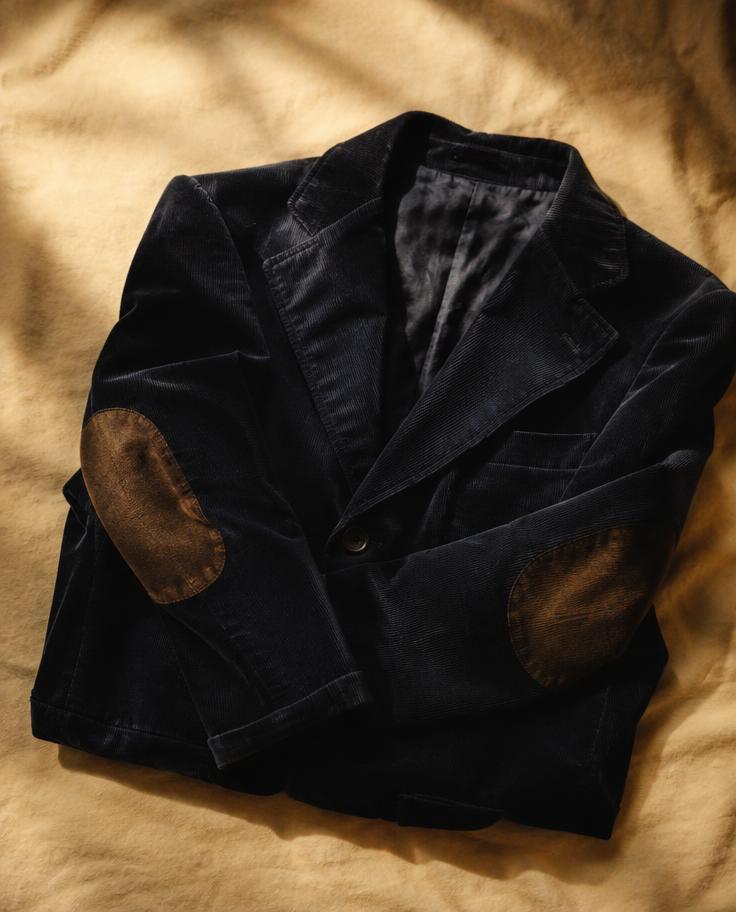 Navy corduroy blazer with worn elbows